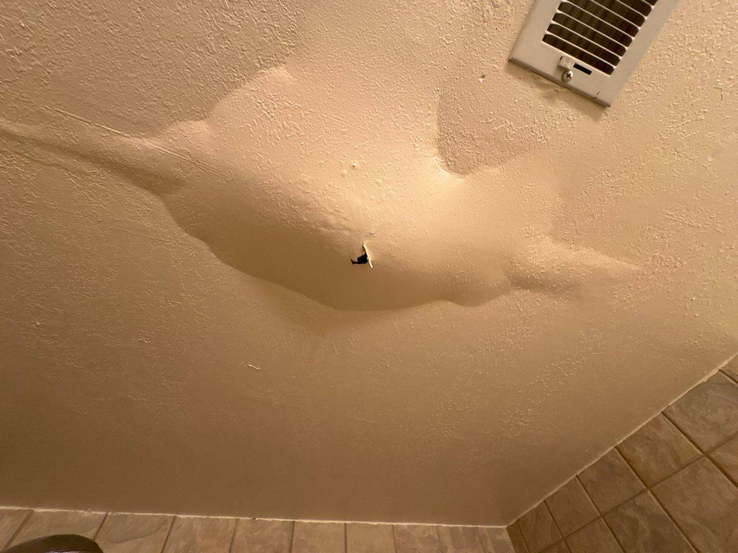 Water damage restoration team working inside a flooded property
